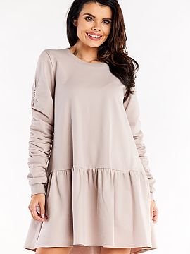Rochie de zi Infinite You  Rochie lejeră, cu mâneci lungi, decolteu rotund și tiv cu volane. Mâneci cu pliuri decorative.