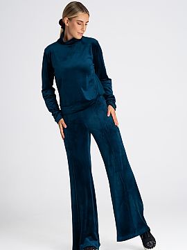 Pantaloni de trening Figl  Pantaloni cu fundul clopot pentru femei. Confecționați din catifea cu o creștere înaltă, care subțiază optic talia.