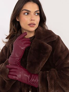 Mănuşi AT  Mănuși elegante de damă din material călduros combinate cu piele ecologică. Butoni decorativi la încheieturi. Degetul arătător cu fl