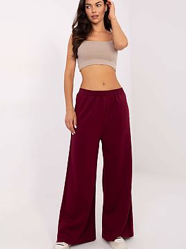 Pantaloni de trening Italy Moda  Pantaloni de damă sport în stil casual, ideali pentru zi de zi și pentru relaxare acasă. Confecționați dintr-un material moale tip unt