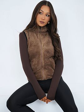 Vestă Factory Price  Vestă elegantă de damă cu un caracter casual, ideală pentru zi de zi. Confecționată dintr-un material moale și blănos cu predominan�