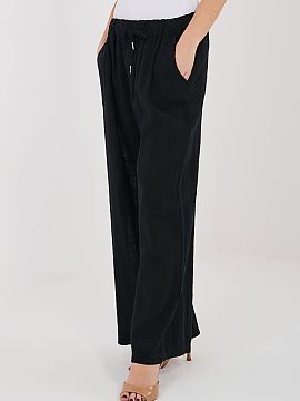 Pantaloni de damă Italy Moda  Pantaloni eleganți de damă cu croială largă, care combină confortul cu un stil la modă și lejer. Modelul are picioare largi, ceea ce 