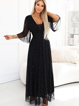 Rochie lungă Numoco  Această rochie neagră maxi plus size impresionează cu un luciu subtil, care reflectă frumos lumina la fiecare mișcare. Partea superioar