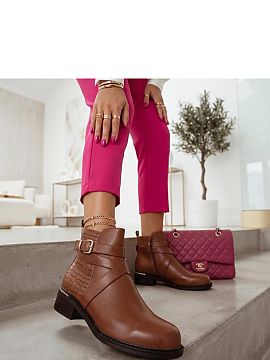 Botine Solea  Botinele pentru femei cu o cataramă decorativă și o inserție pe călcâi sunt un model elegant care combină forma clasică cu detalii l