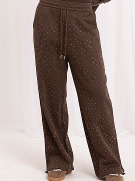 Pantaloni de trening Italy Moda  Pantaloni sportivi largi pentru femei sunt o propunere elegantă care combină confortul unei croieli sportive cu o finisare la modă și ex