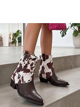 Botine cu toc Solea  Botinele pentru femei cu un model modern de blăniță de vacă sunt o propunere pentru femeile care iubesc accesoriile distinctive. Realiza